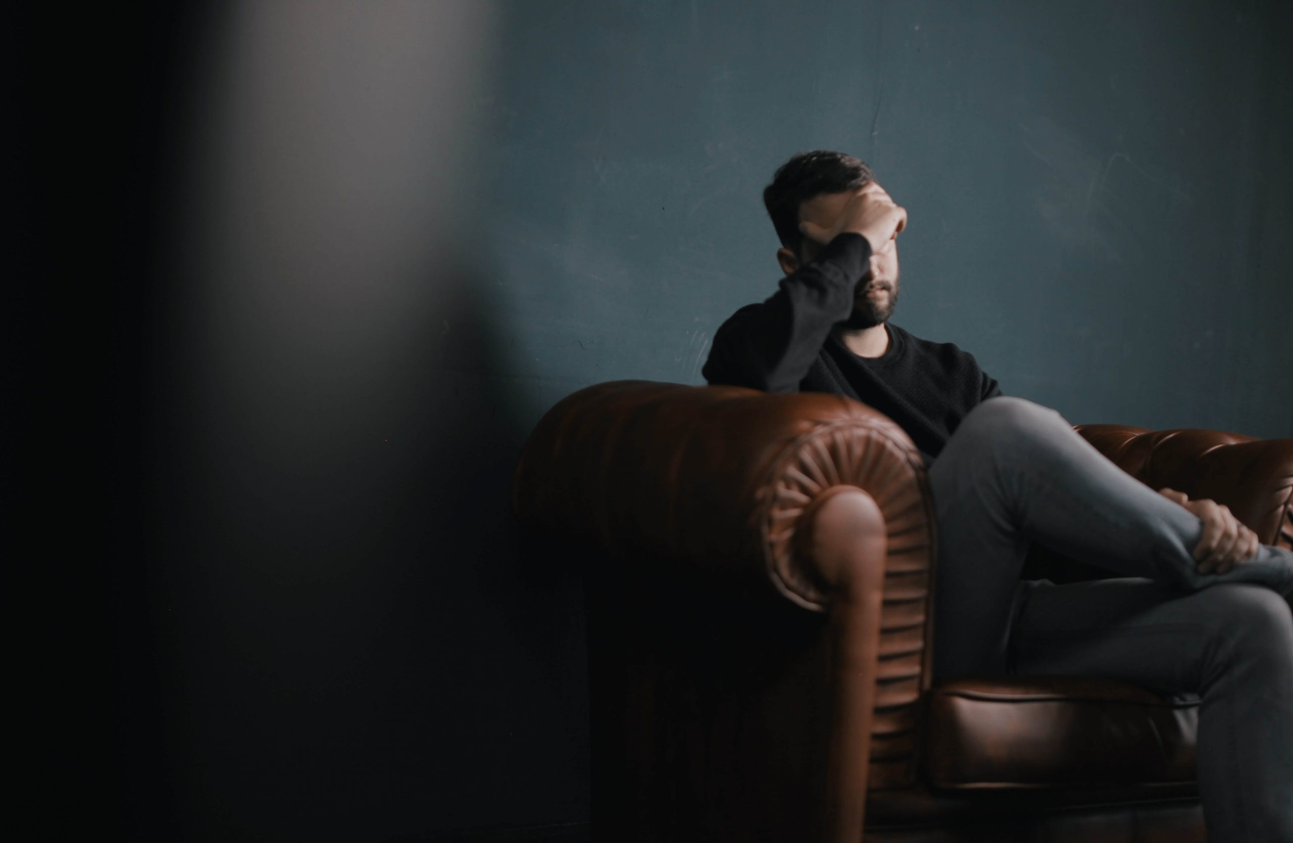 stressed man on sofa